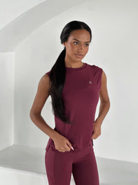 FLOW SOFT TANK in WINE, worn sleeveless tank with small logo detail on front