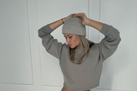 Ultimate Knit Beanie in Elephant grey, worn with oversized grey sweatshirt