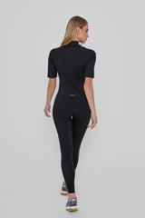 Model wears ACHIEVER SLIM FIT TOP in black 