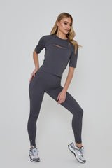 Model wears POWER LEGGINGS in grey