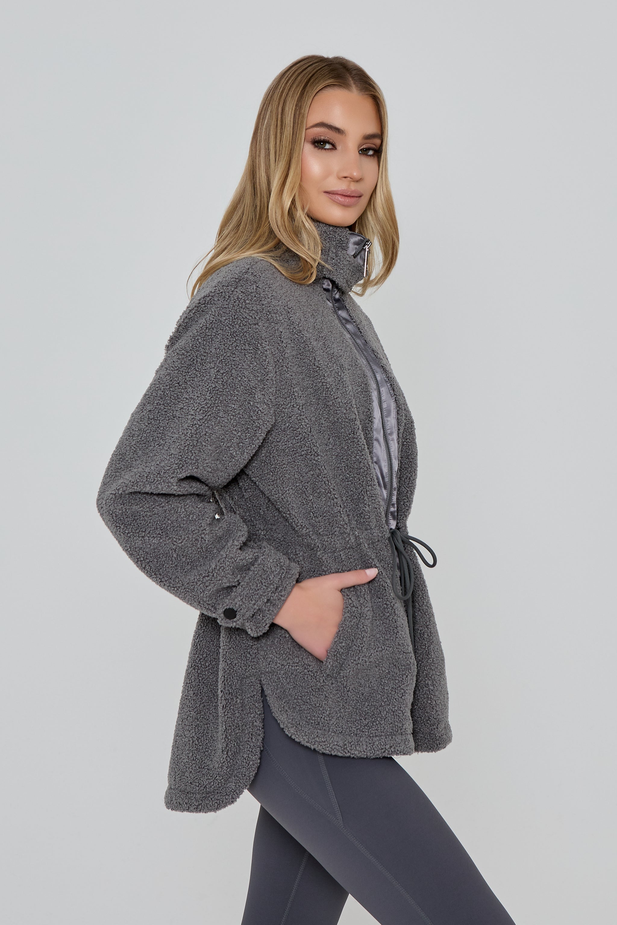 Model wears FREEDOM SHERPA JACKET in grey 