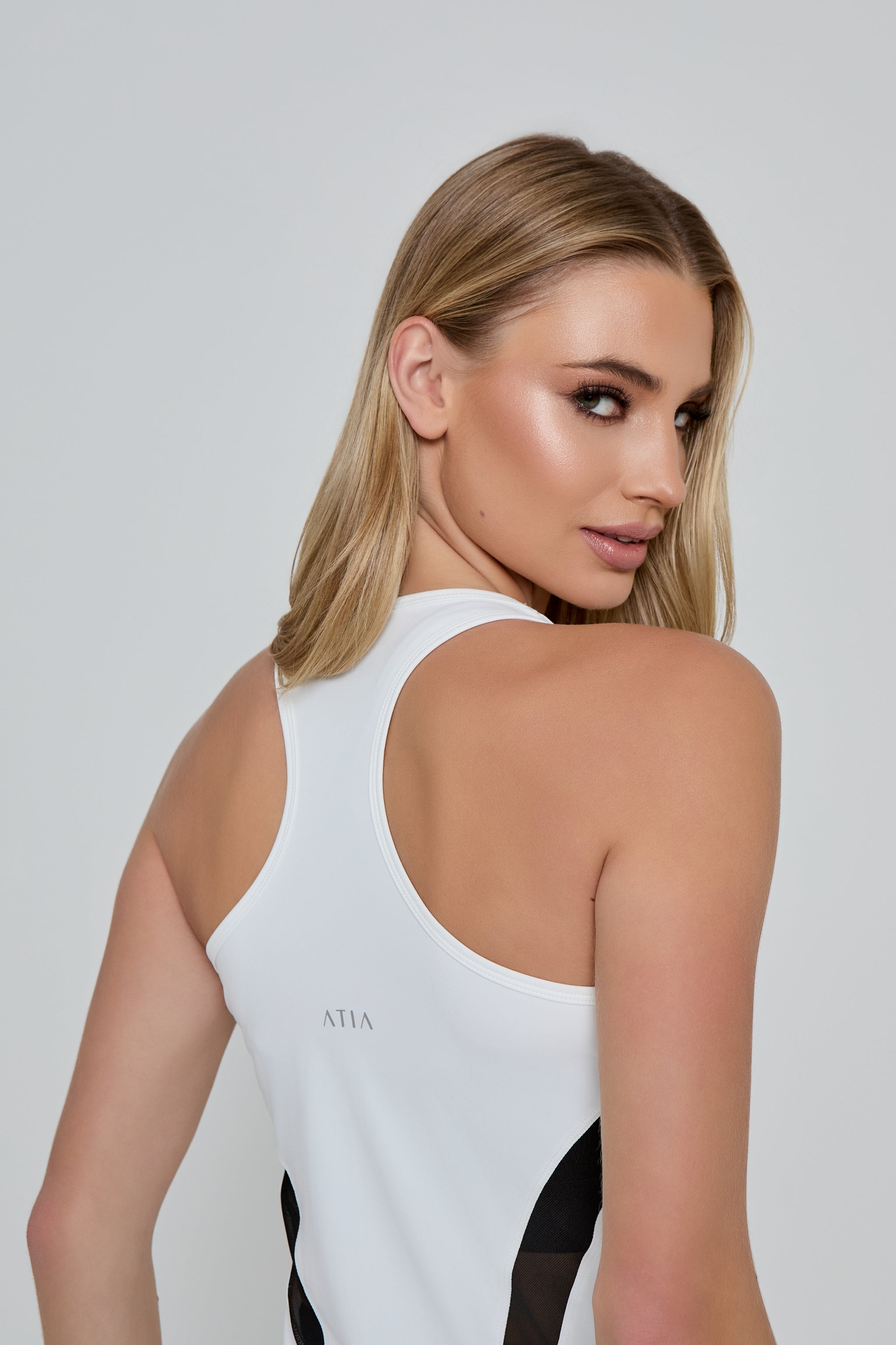 Model wearing DYNAMIC SPORTS VEST in white 