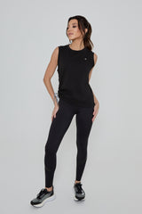 Model wearing DIRECTION LEGGINGS in black with CHALLENGER TANK