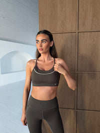 BALANCE sports bra in Turkish Coffee, worn with matching leggings, front view showing scoop neckline and supportive fit.
