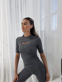 LIMITLESS FITTED TOP in CASTLEROCK, short-sleeved with peephole detail, worn fitted on model