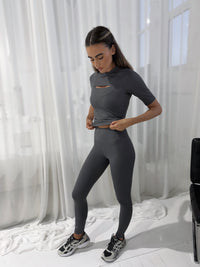 Power Leggings Castlerock grey high-waist leggings worn with matching crop top and sneakers