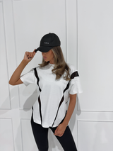 AGILITY SPORTS CAP in BLACK, worn by model with white t-shirt and black pants